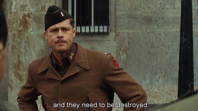 Screenshot of Lt. Aldo Raine speaking to his men. Subtitle says "and they need to be destroyed"